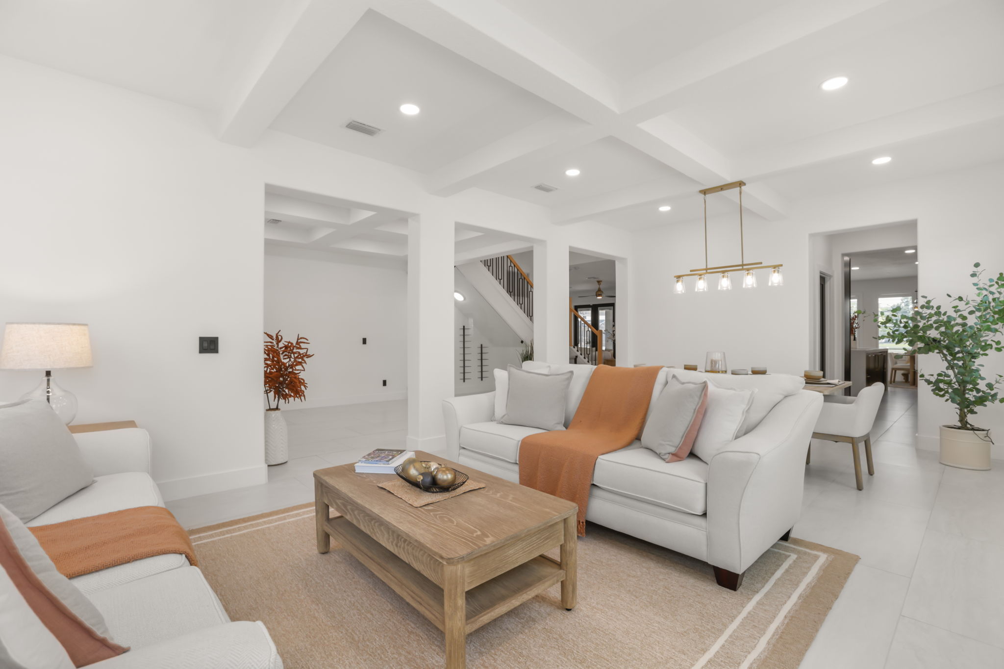 Living room open to dining and staircase